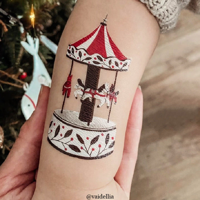 Temporary tattoo of a carrousel on a child's arm.