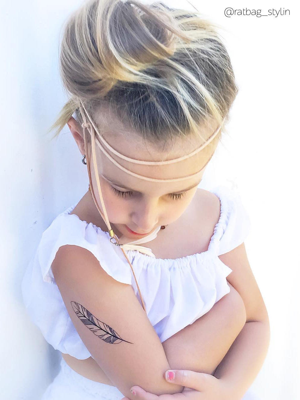 Black feather bohemian temporary tattoo for boho girls from Feathers and arrows big fake tattoos set. Great wedding children's table filler from Ducky street.