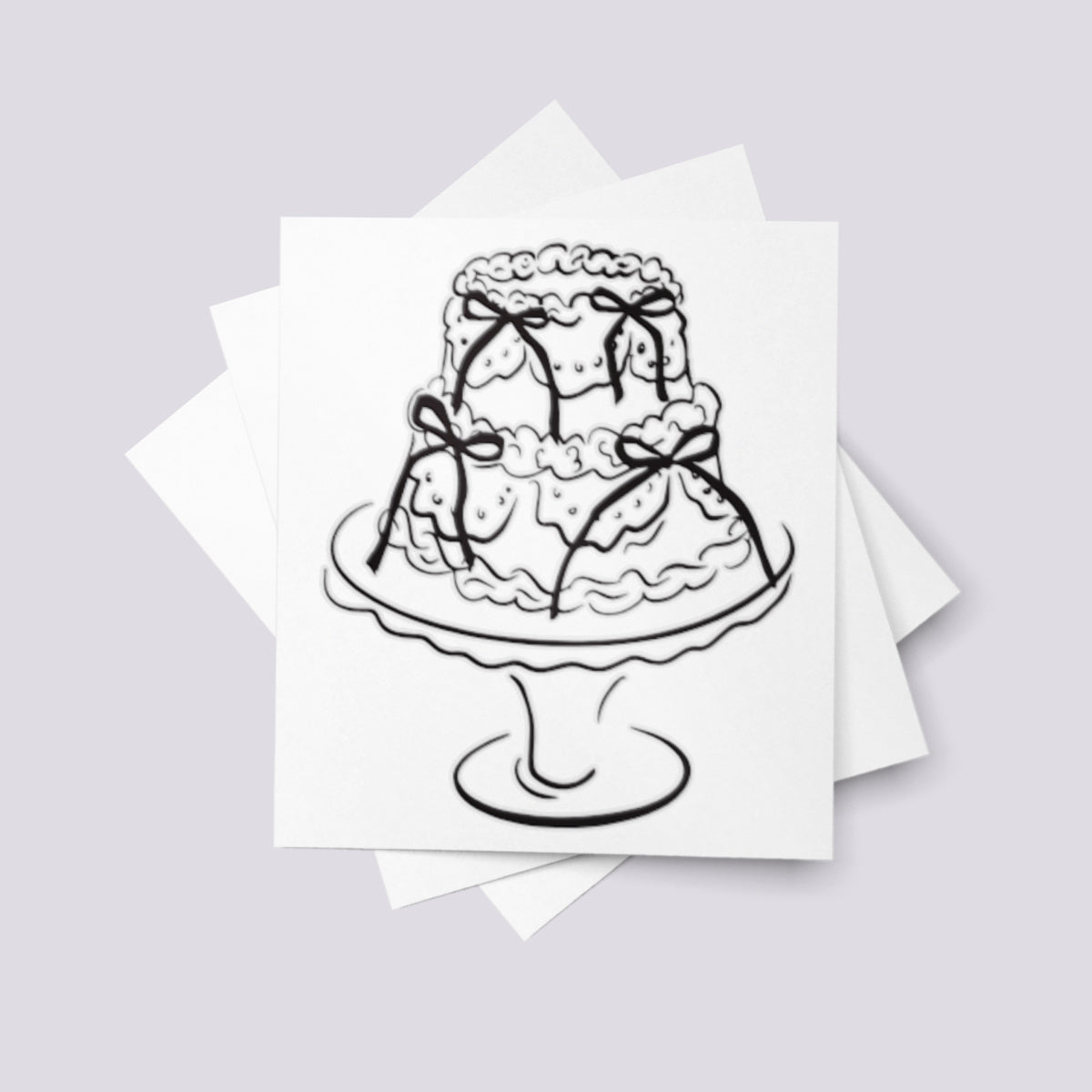 Temporary tattoo of a wedding cake decorated with ribbons.