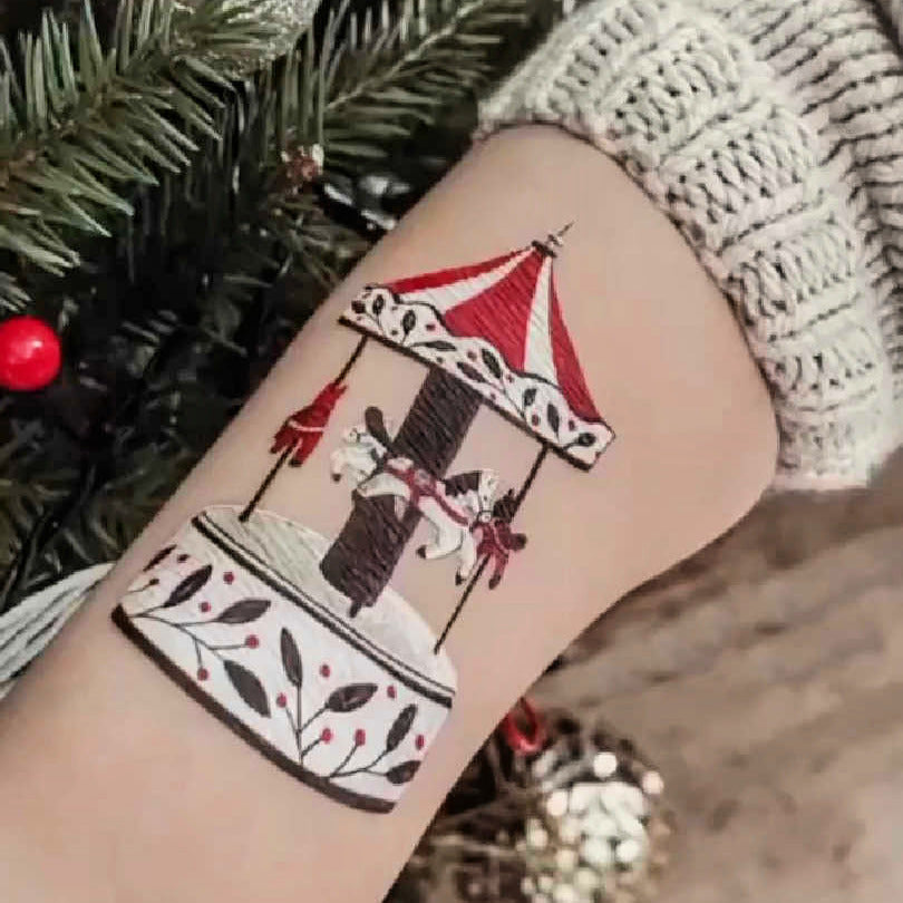 Temporary tatoo of a retro of carousel on a child's arm.