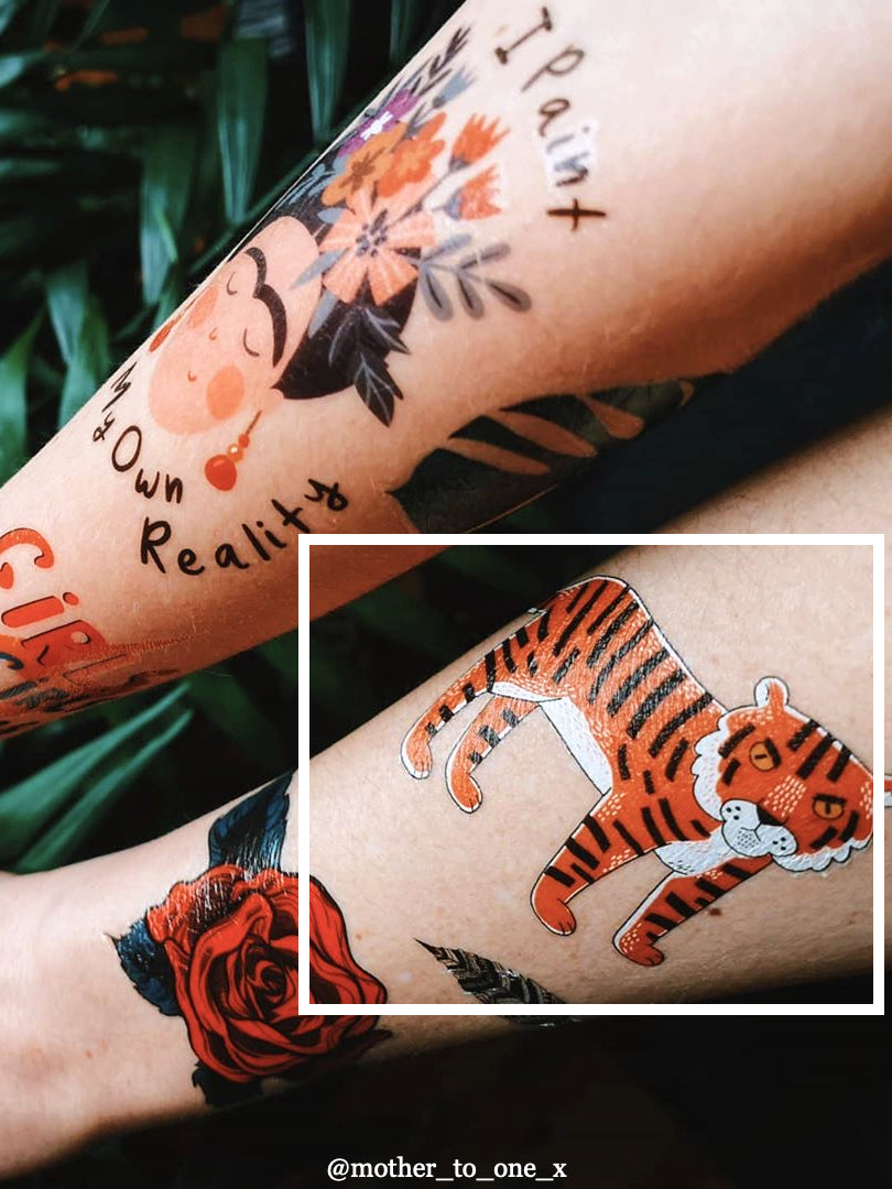 Whimsical folk art capturing the menacing paper tiger with jaws agape and  menacing claws