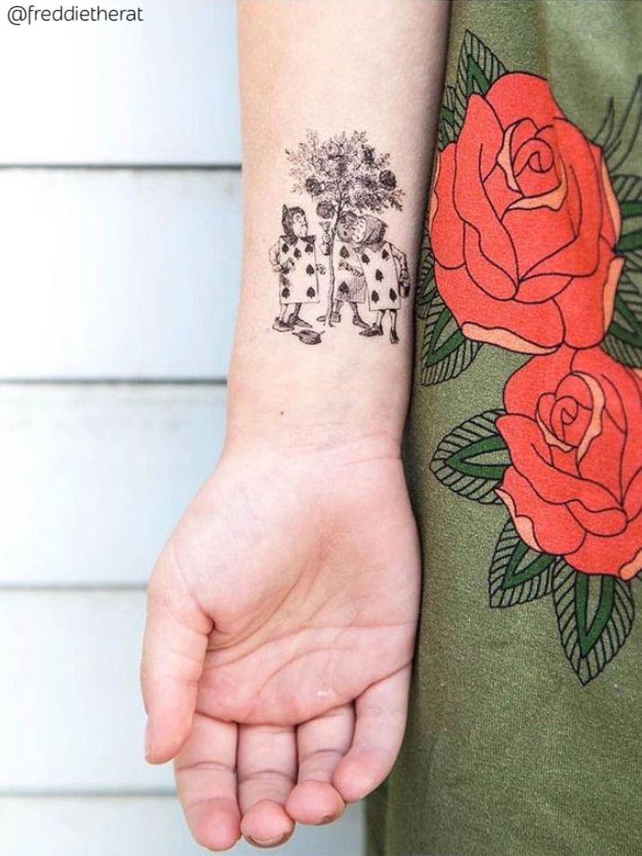 Alice in Wonderland temporary tattoo with cards and roses.