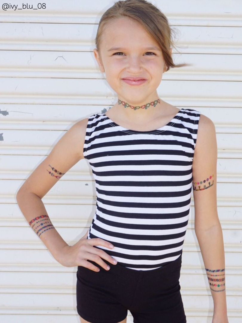 Tatted up with Arm candy temporary tattoos girl. Fake kids body stickers for girls party tattoo parlor.